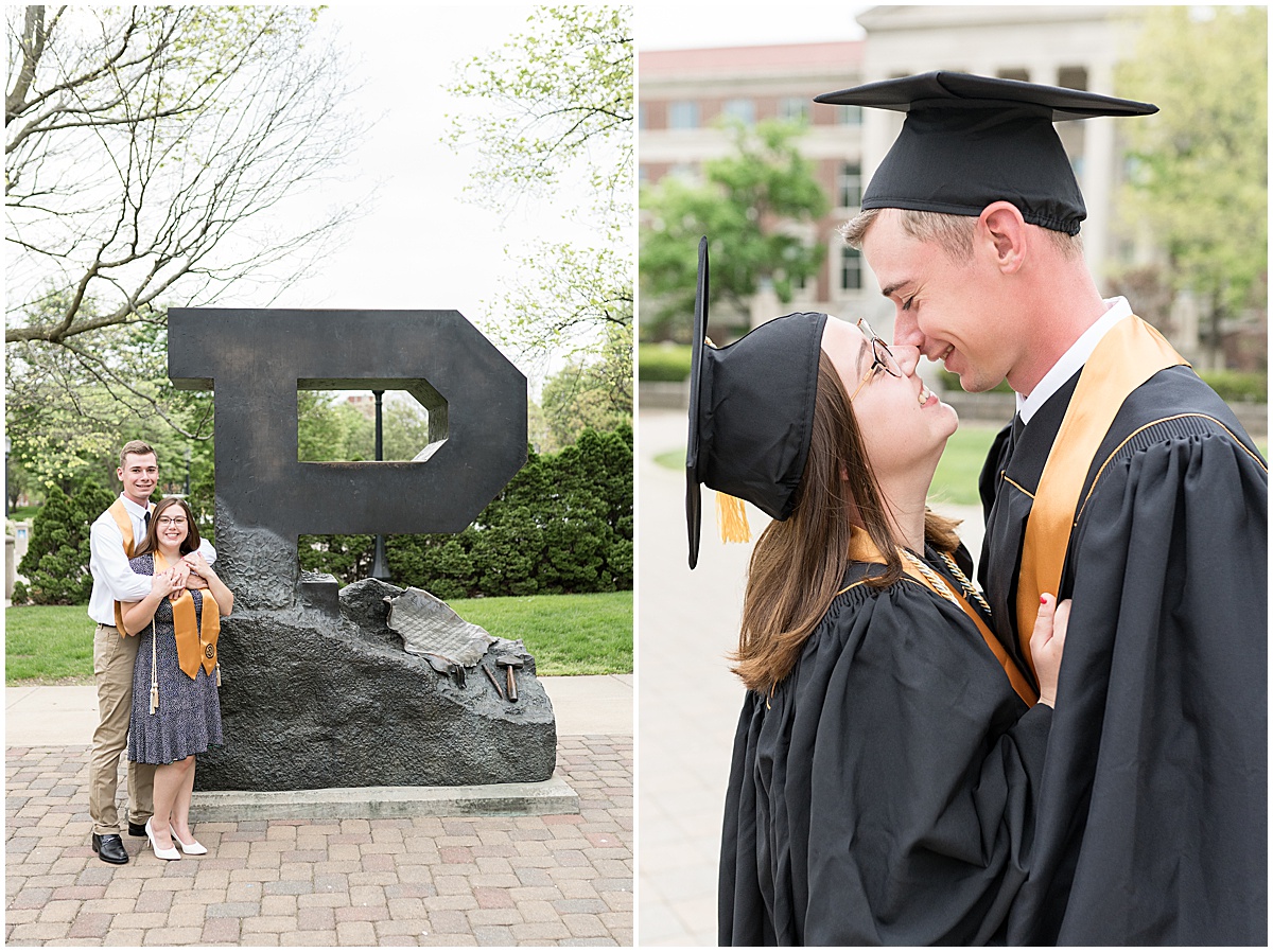 Couple kiss during graduation photos at Purdue University in front of the Purdue Memorial Union