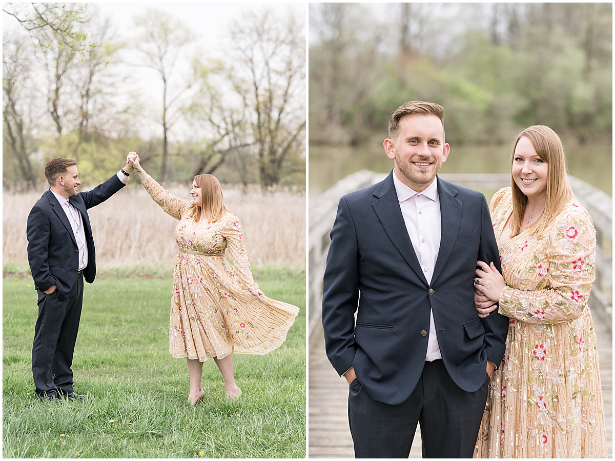 Couple dancing in field by water in engagement photos at Wildcat Creek Reservoir Park in Kokomo, Indiana