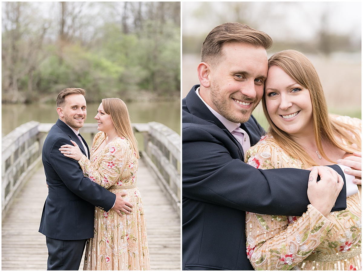 Couple by water during early spring engagement photos at Wildcat Creek Reservoir Park in Kokomo, Indiana