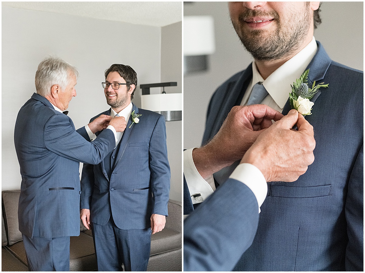Groom having help with tie and boutonniere at Marriott North Indianapolis