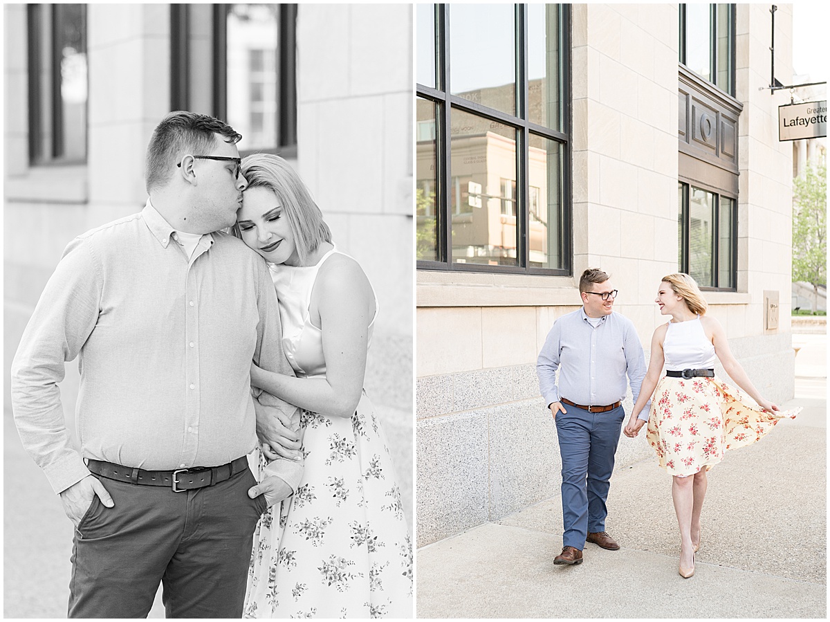 Couple walking down the street at spring engagement photos in Downtown Lafayette, Indiana