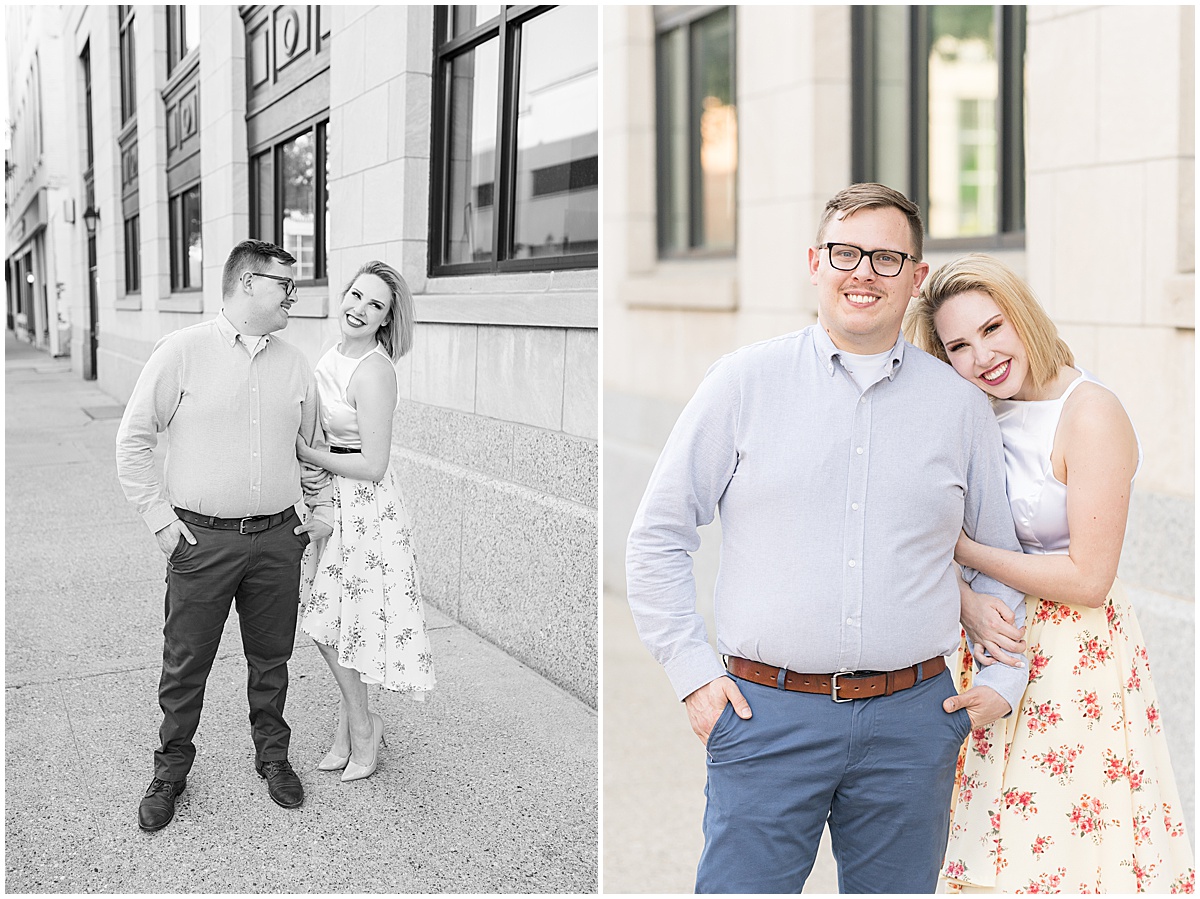 Couple walking down sidewalk during spring engagement photos in Downtown Lafayette, Indiana