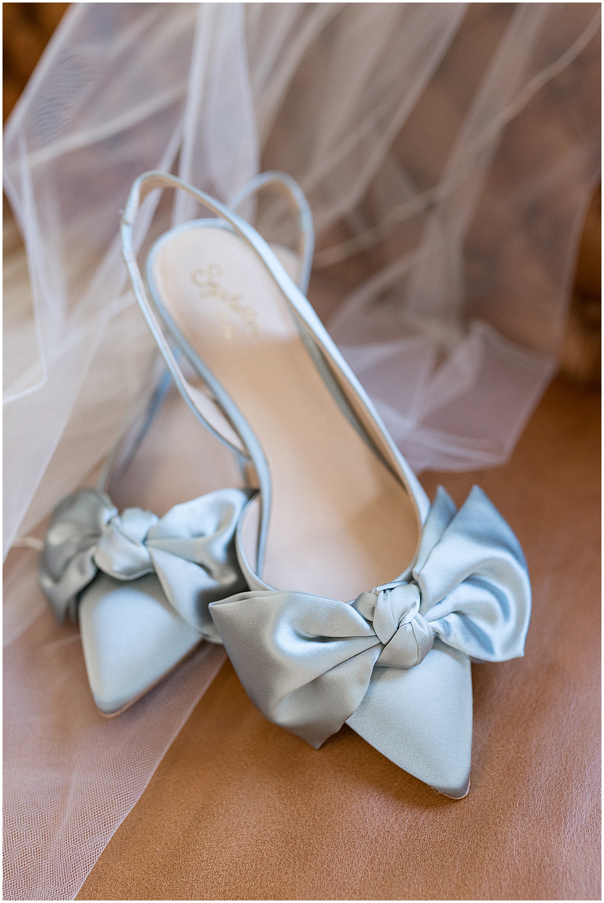 Bride's blue shoes at The Union Club Hotel at Purdue University