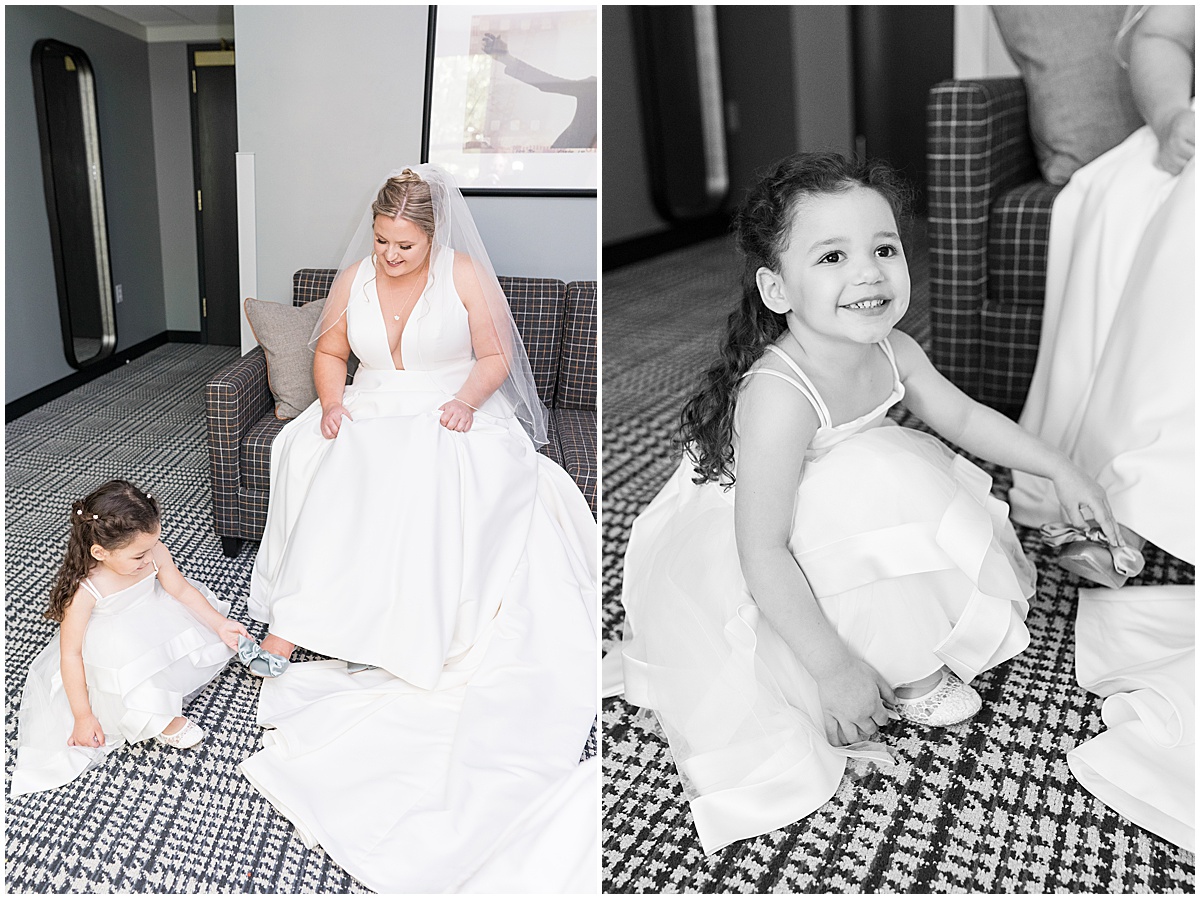 Flower girl helping bride get ready at The Union Club Hotel at Purdue University