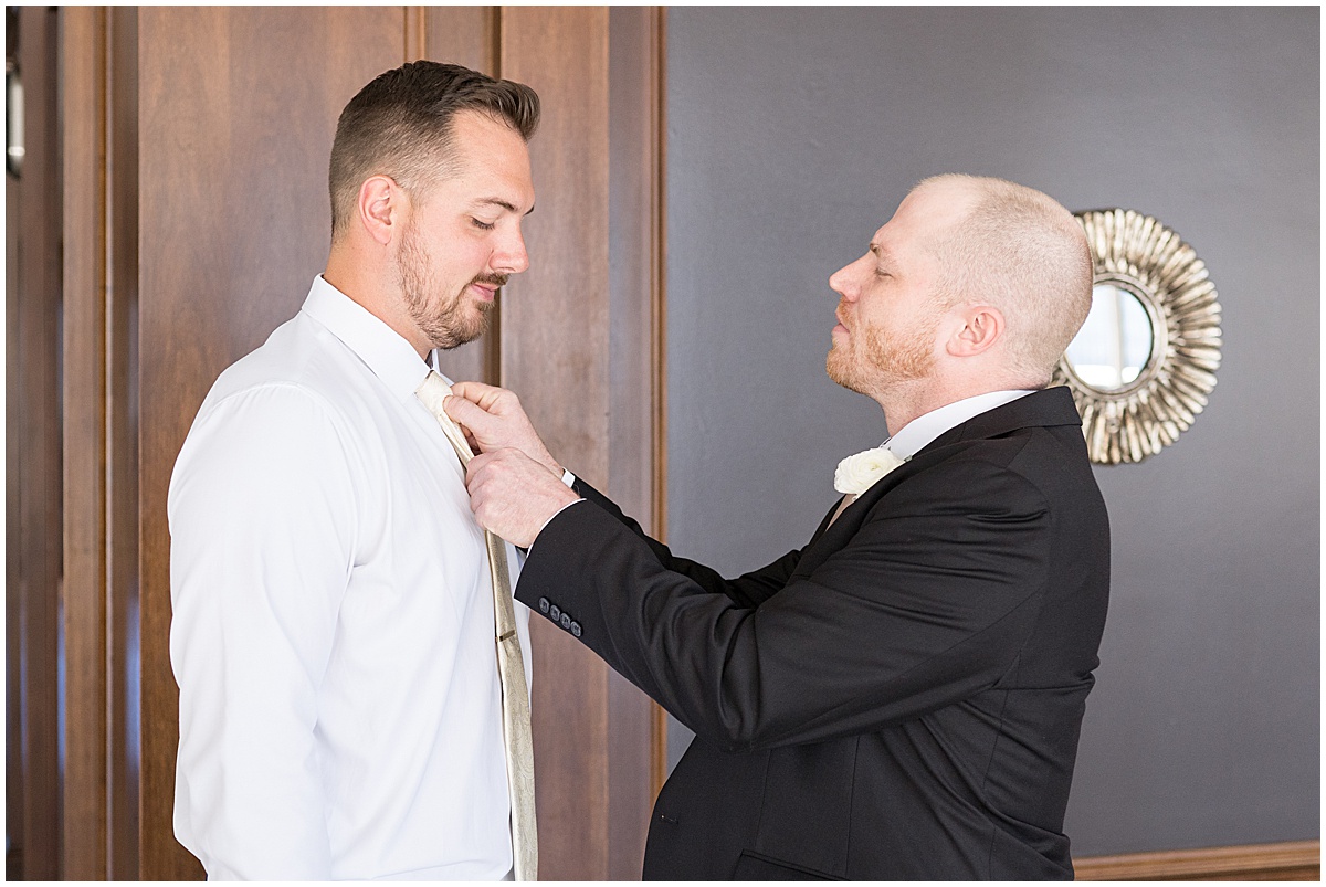Best man helping groom get ready for wedding at JPS Events in downtown Indianapolis.
