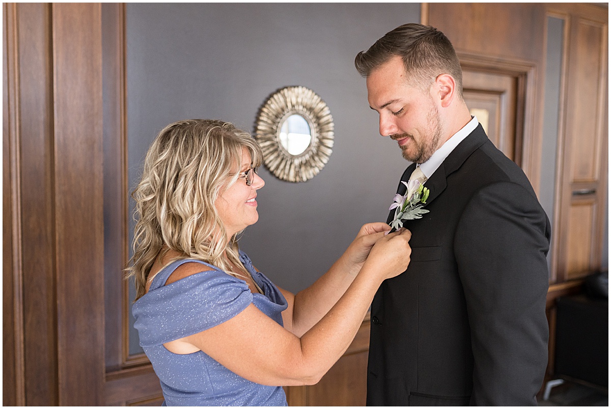 Groom getting boutonniere for wedding at JPS Events in downtown Indianapolis.