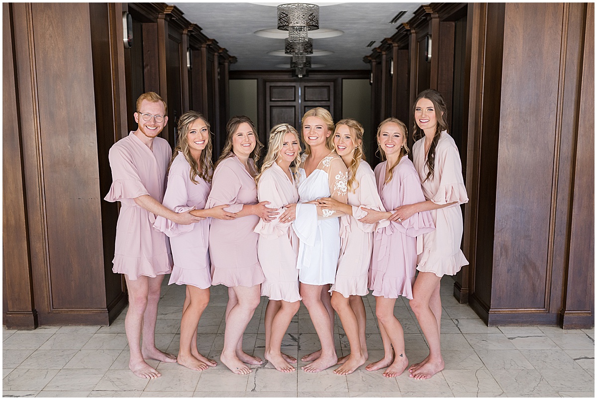 Bride with bridesmaids with robes for wedding at JPS Events in downtown Indianapolis.