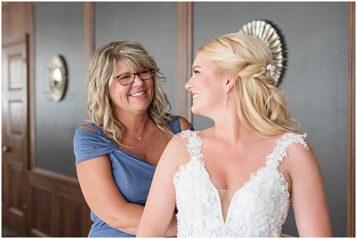 Mother of the bride helping bride get ready for wedding at JPS Events in downtown Indianapolis.