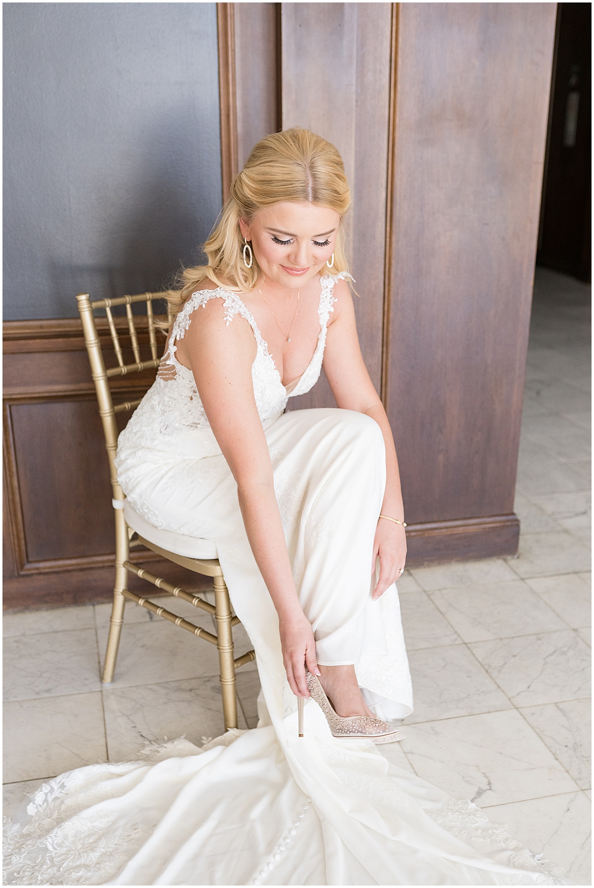 Bride putting on shoes for wedding at JPS Events in downtown Indianapolis.