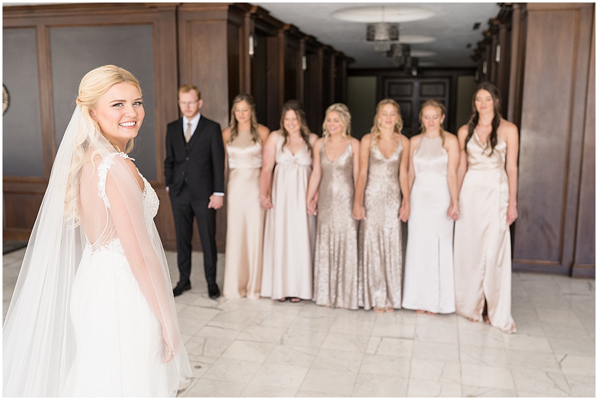 Bride before first look with bridesmaids for wedding at JPS Events in downtown Indianapolis.