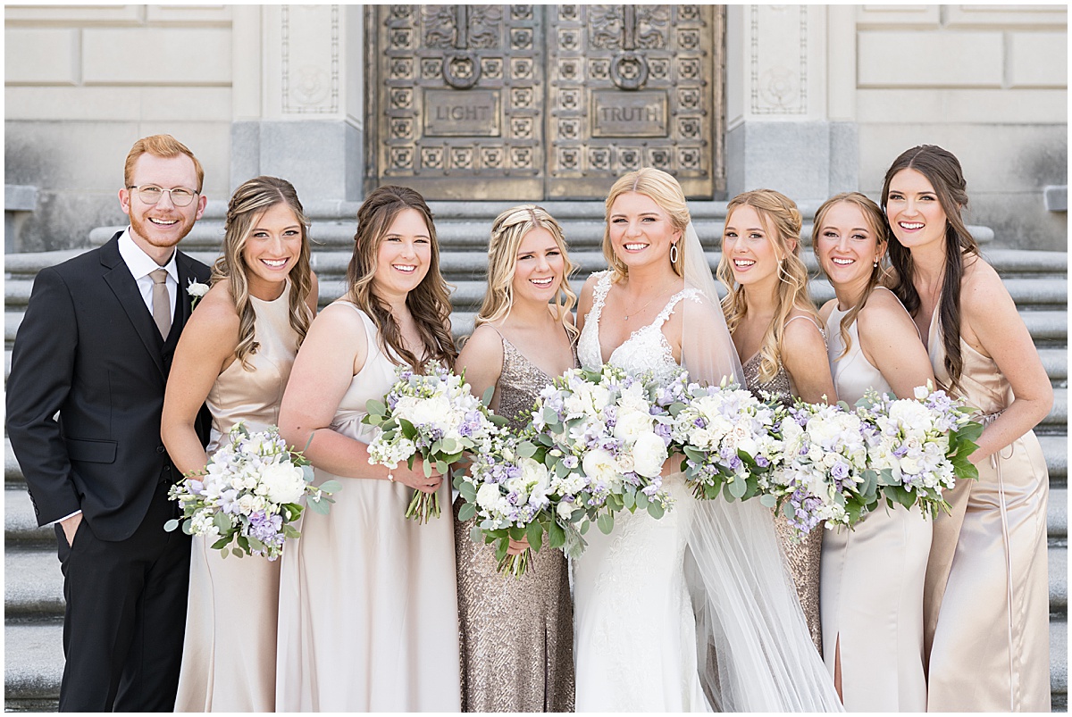 Bridesmaids in gold dresses at The Indiana War Memorial in downtown Indianapolis.