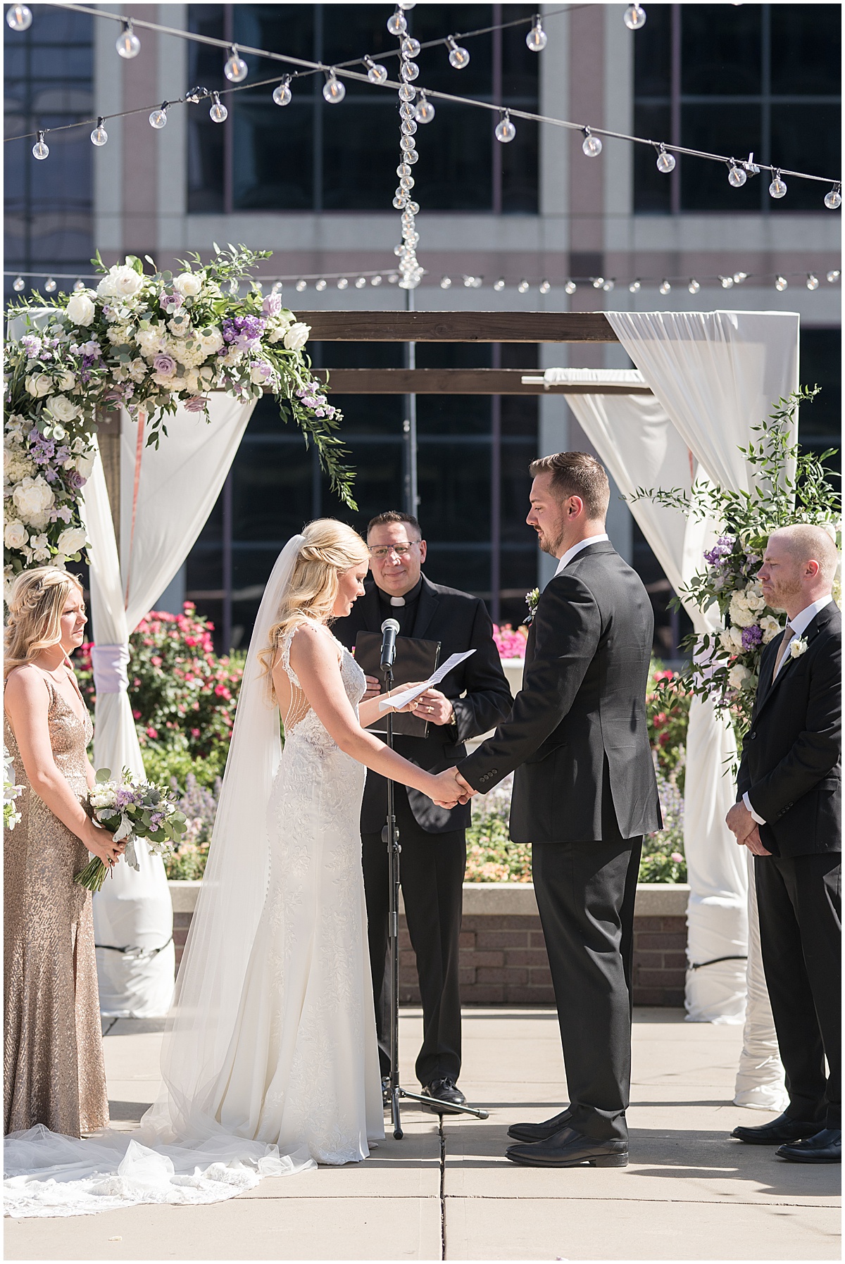 Bride reads vows at rooftop wedding in downtown Indianapolis at JPS Events