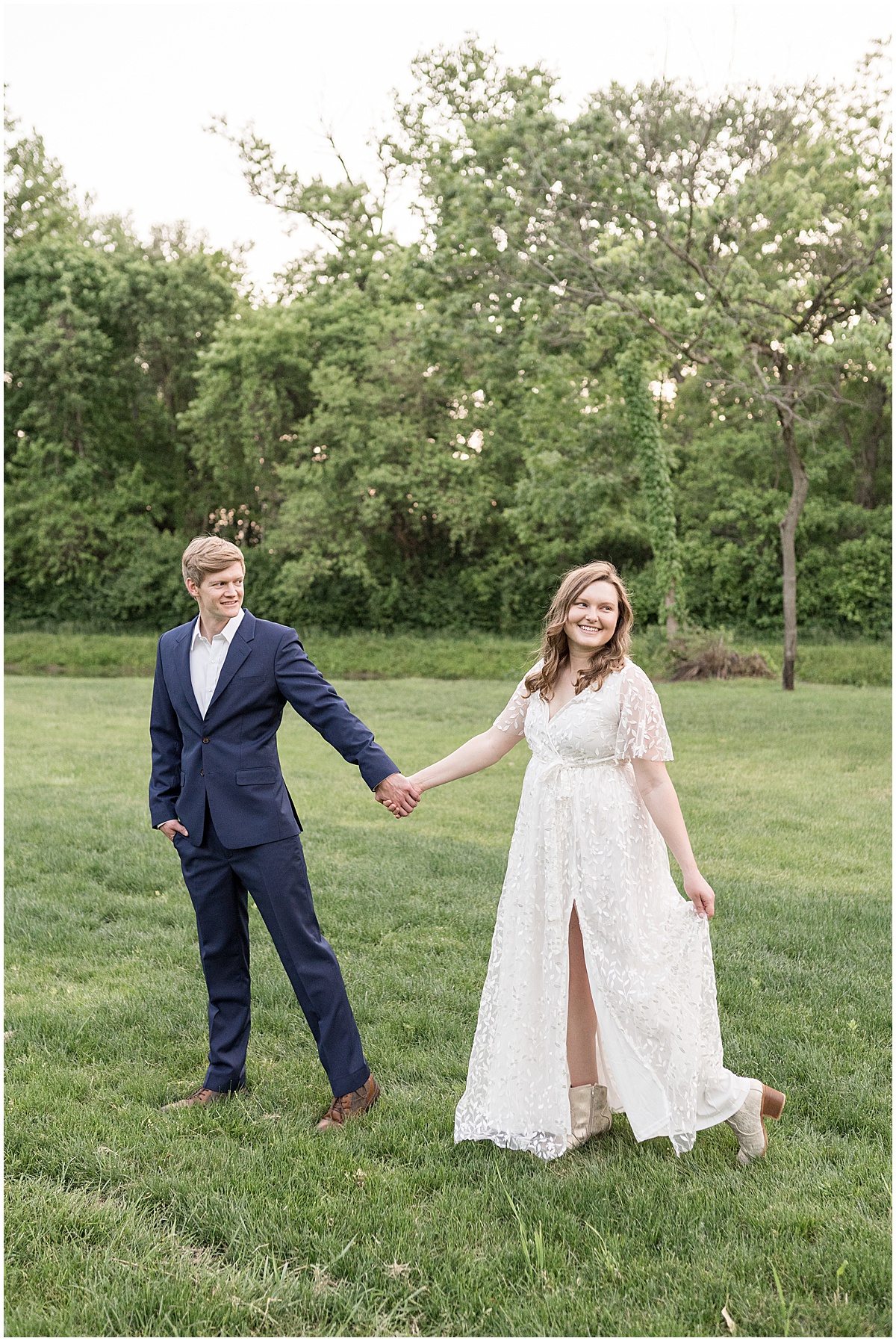 Couple walking together at spring engagement photos at Holcomb Gardens in Indianapolis