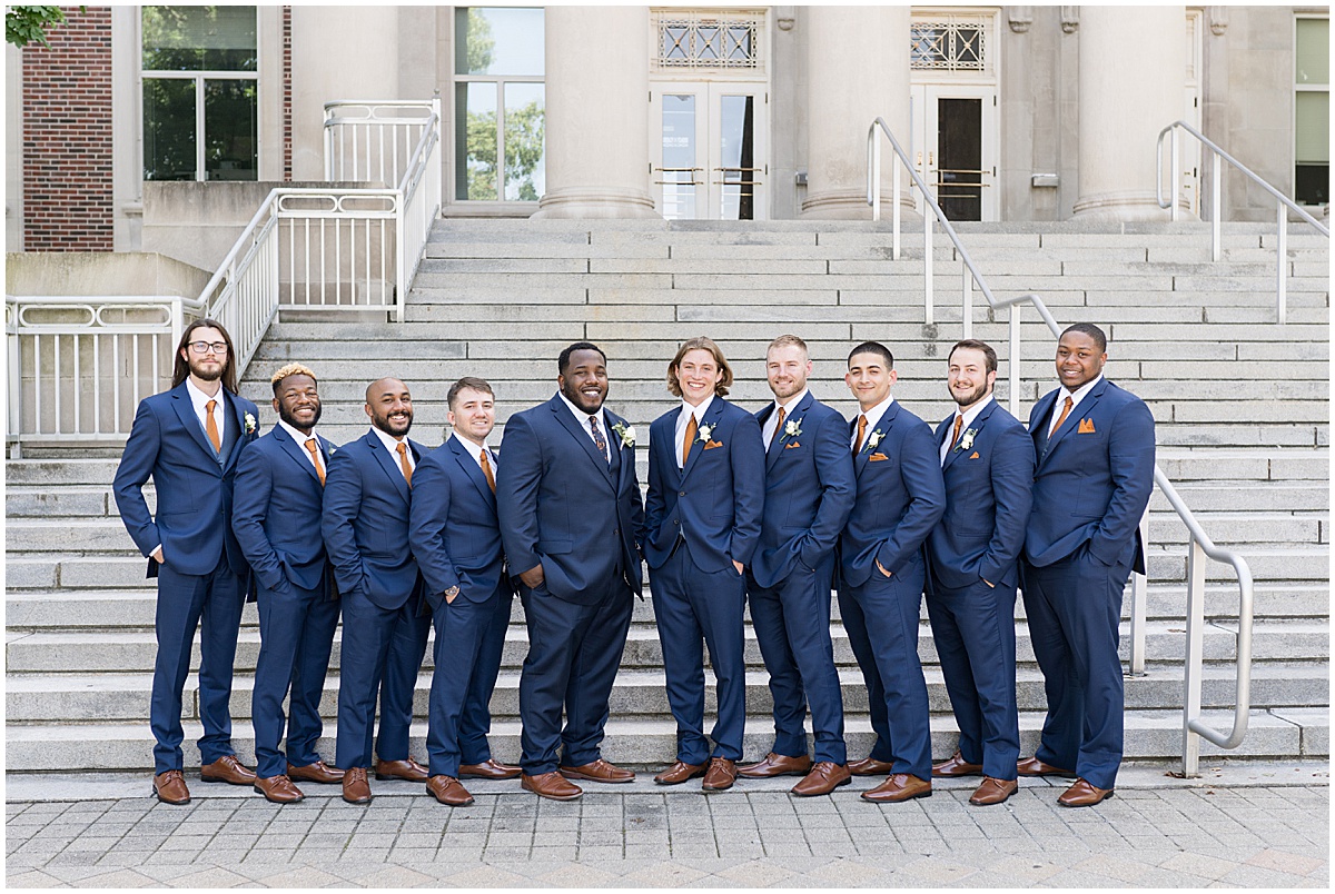 Groom with groomsmen by steps at Purdue University