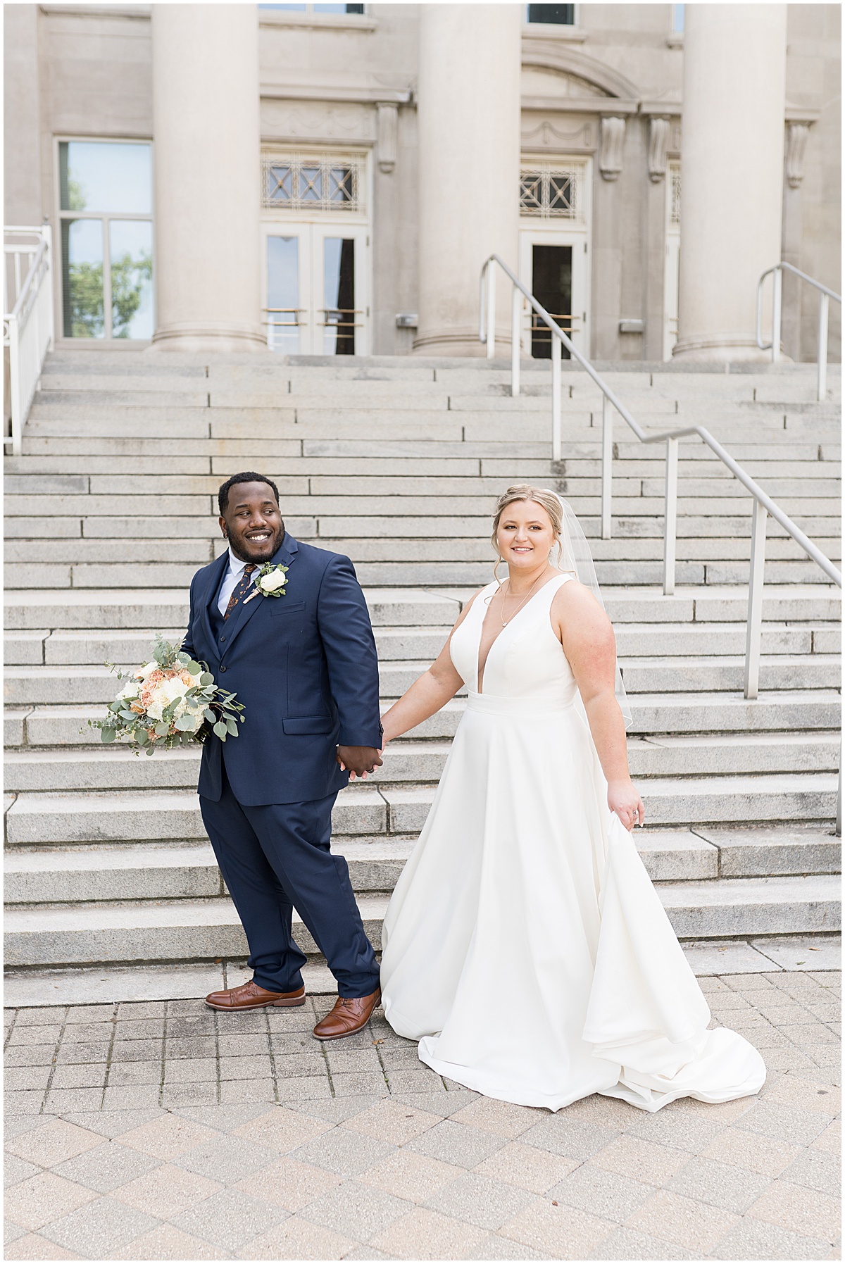 Bride and groom walking together at Purdue University