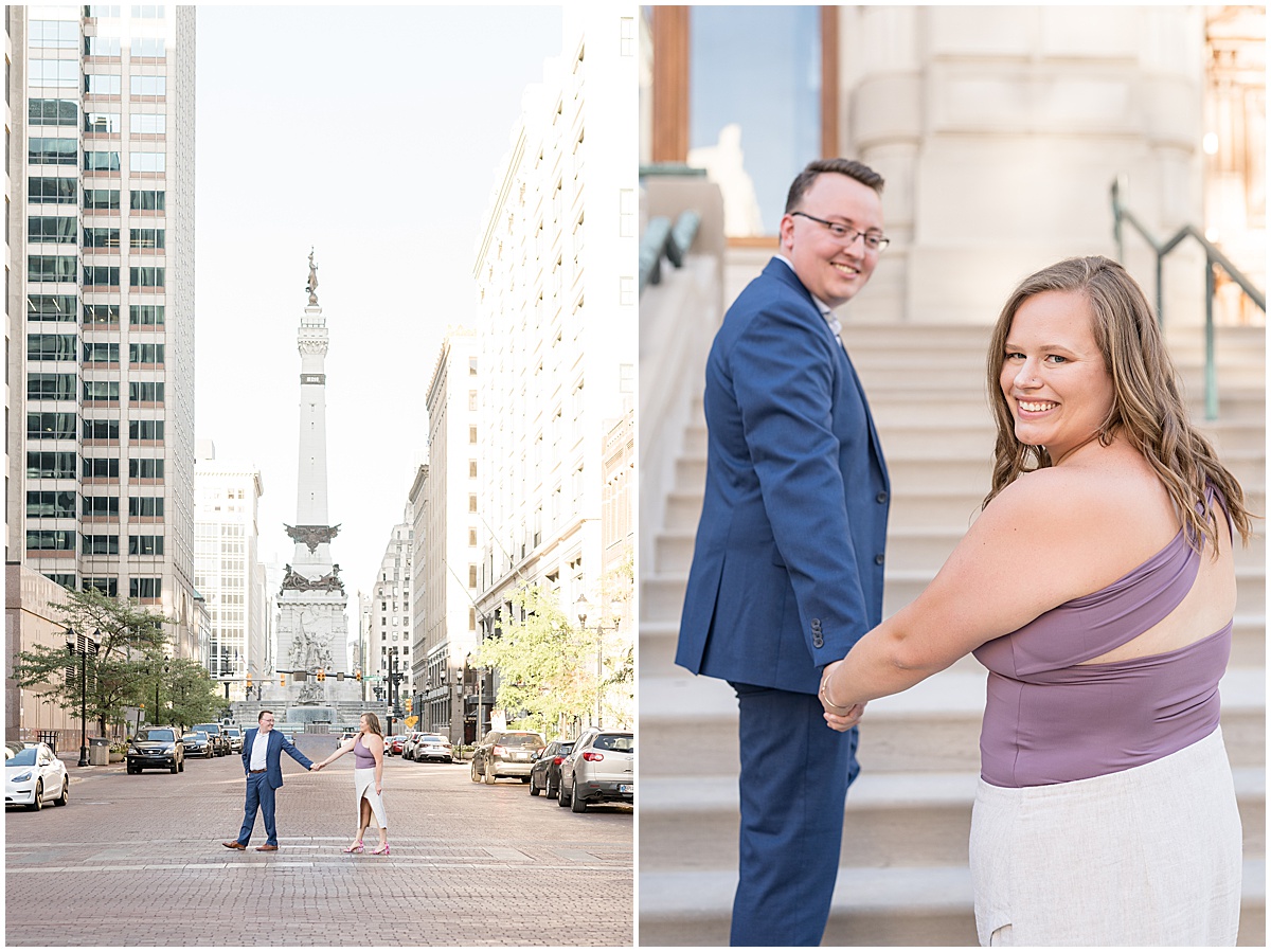 Couple hold hands during engagement photos in downtown Indianapolis in front of the Soldiers and Sailors monument.