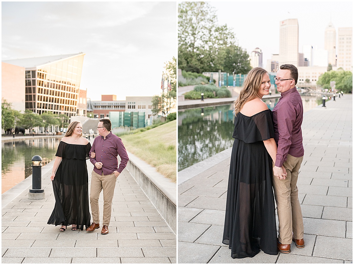 Couple walking hand in hand for downtown Indianapolis Canal Walk engagement photos.