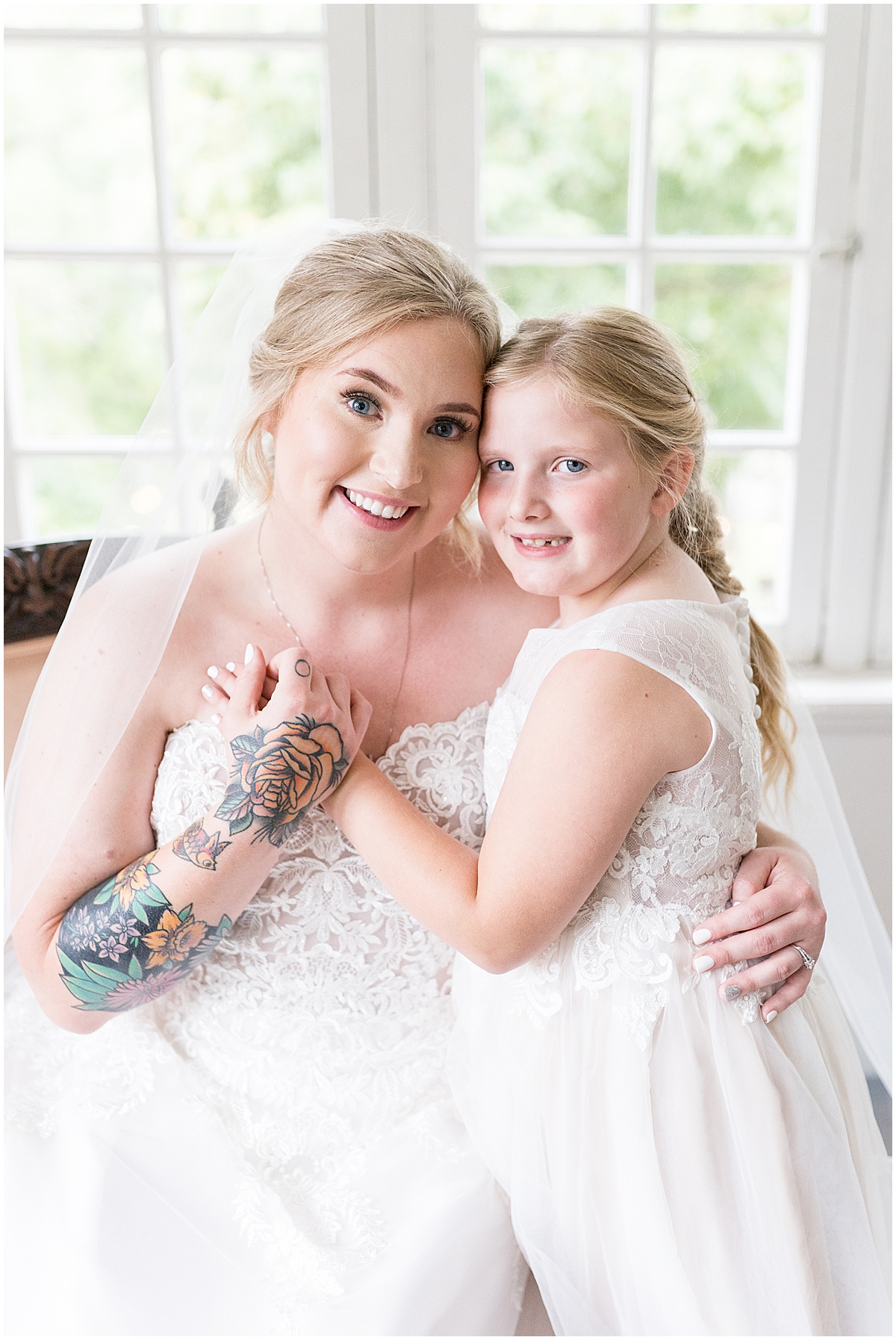 Bride and flower girl get close at Fowler House Mansion wedding