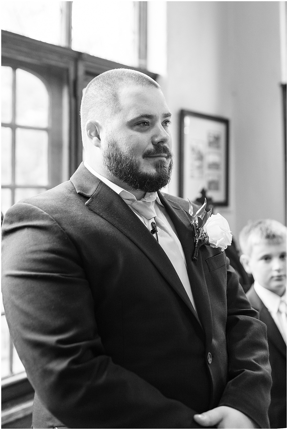 Groom's reaction to bride walking down the aisle in Fowler House Mansion wedding ceremony
