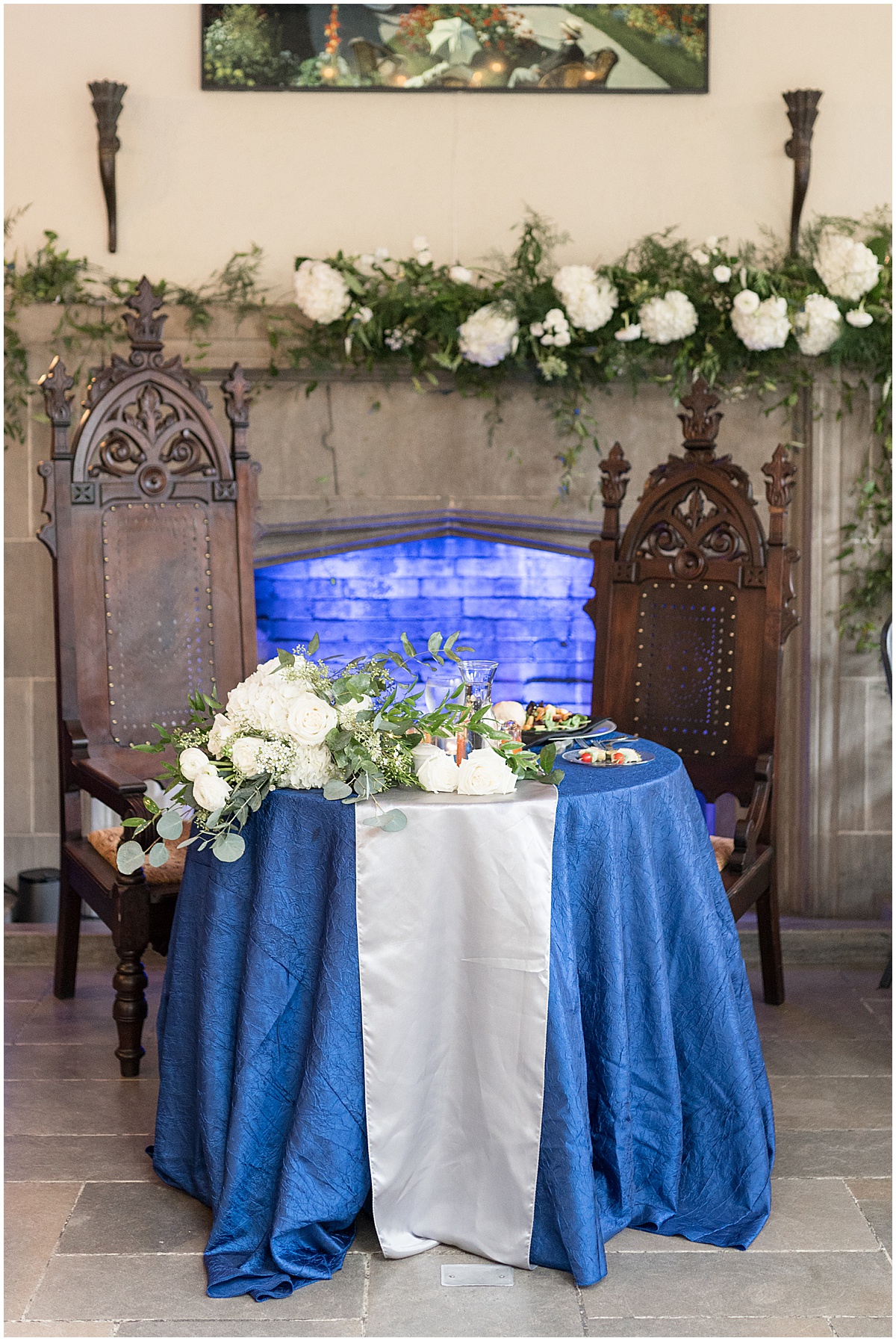 Bride and groom table with thrones at Fowler House Mansion wedding reception