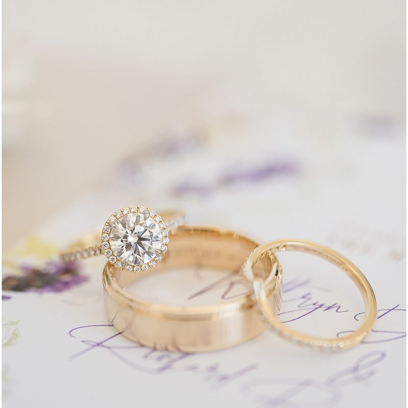 Wedding rings on invitation before JPS Events wedding in downtown Indianapolis photographed by Indianapolis wedding photographer Victoria Rayburn Photography