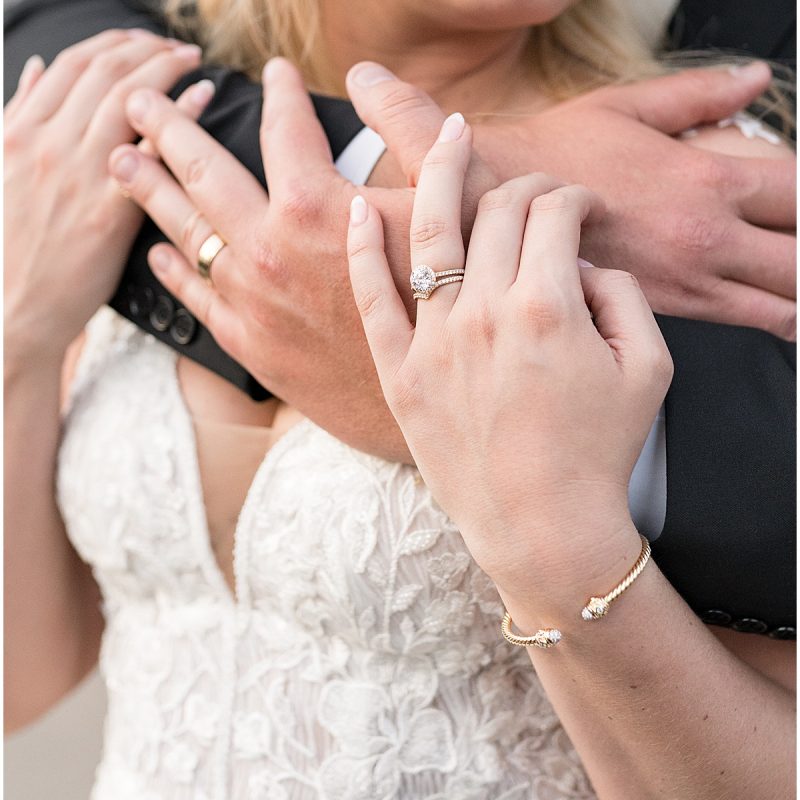 Bride and groom interlocked hands at downtown Indianapolis wedding