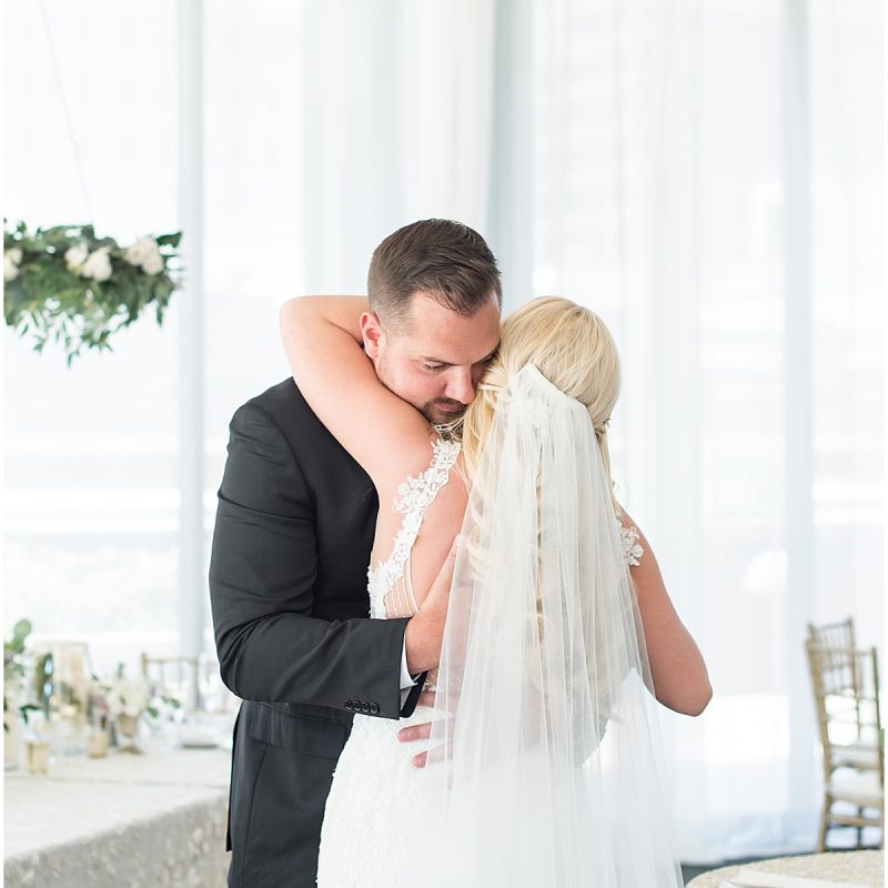 Bride and groom hug after first look at JPS Events Wedding in Downtown Indianapolis
