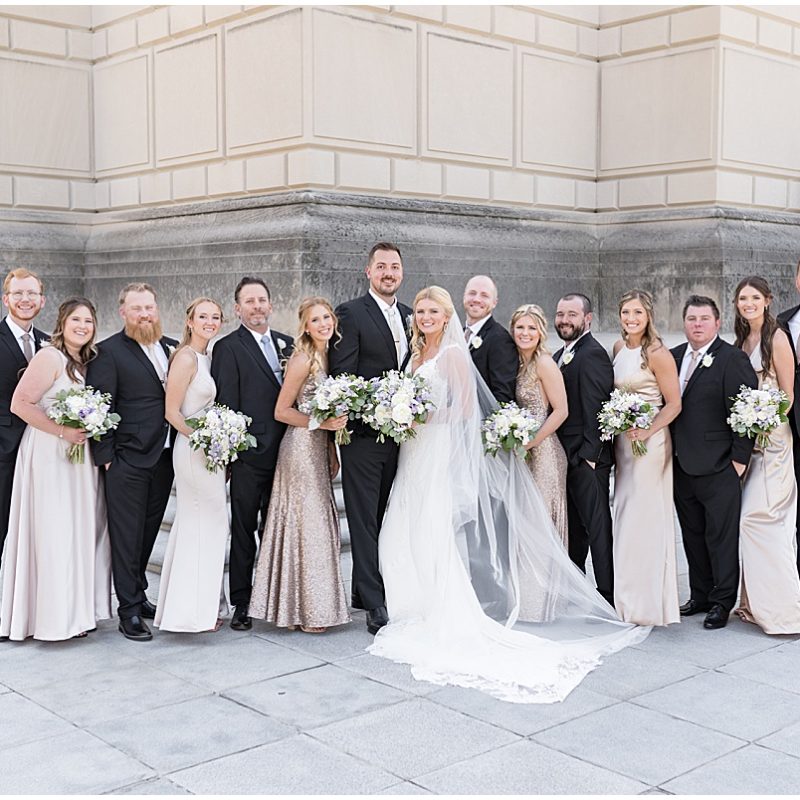 Bridal party wearing champagne and black at at The Indiana World War Memorial in Downtown Indianapolis