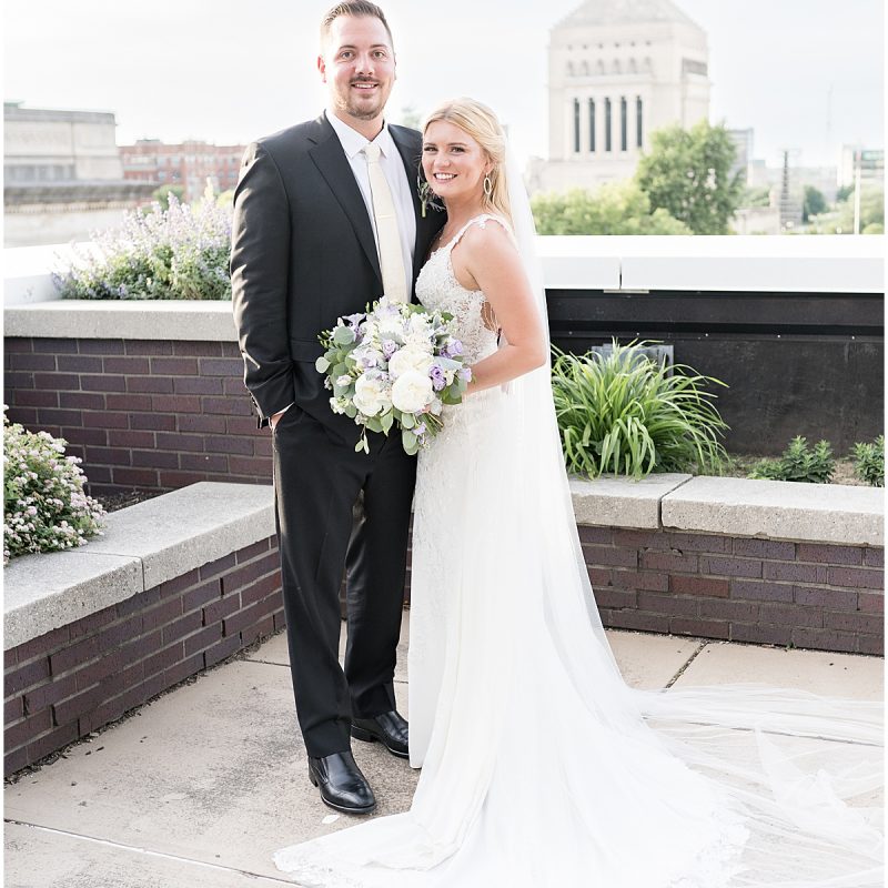 Bride and groom wedding photos on rooftop after downtown Indianapolis wedding
