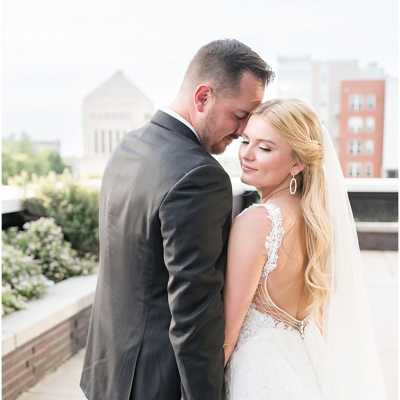 Newlyweds embrace on rooftop after JPS Events Wedding in Downtown Indianapolis