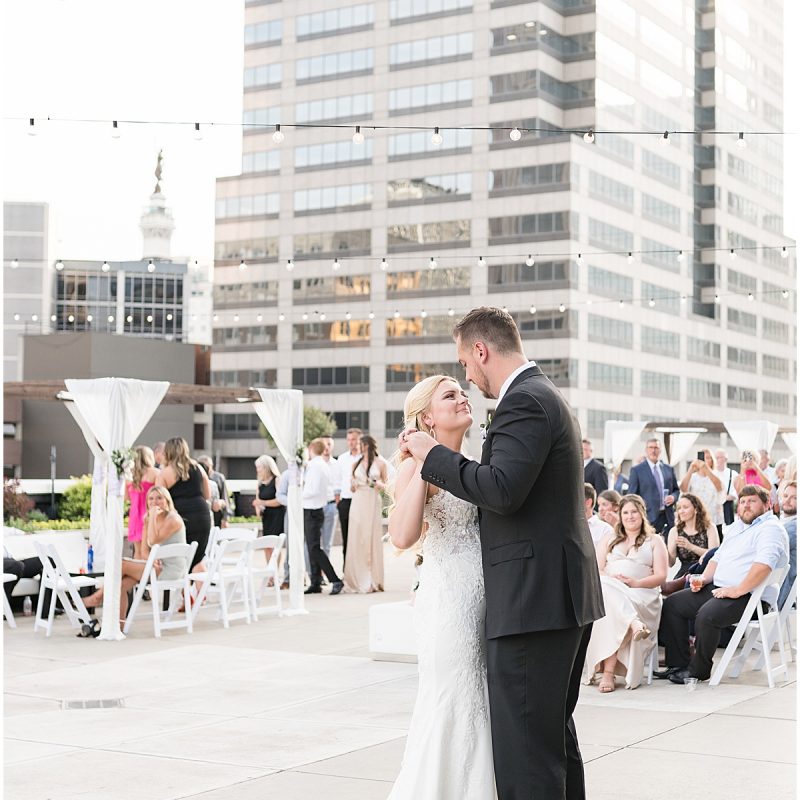 Bride and groom dance on rooftop at JPS Events Wedding Reception in Downtown Indianapolis