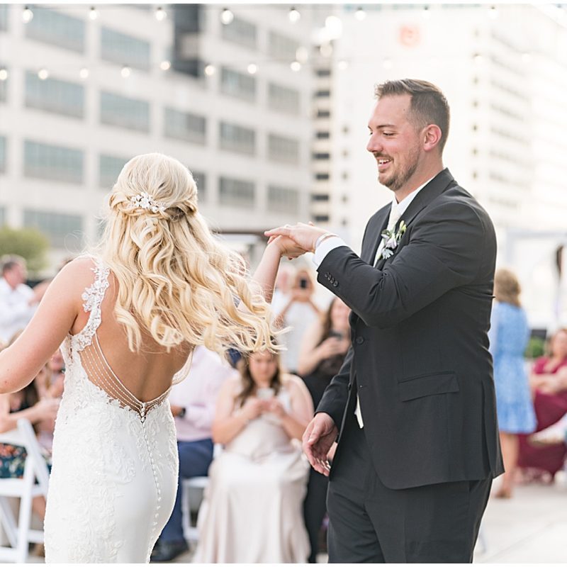 Bride and groom dance on rooftop at JPS Events Wedding Reception in Downtown Indianapolis