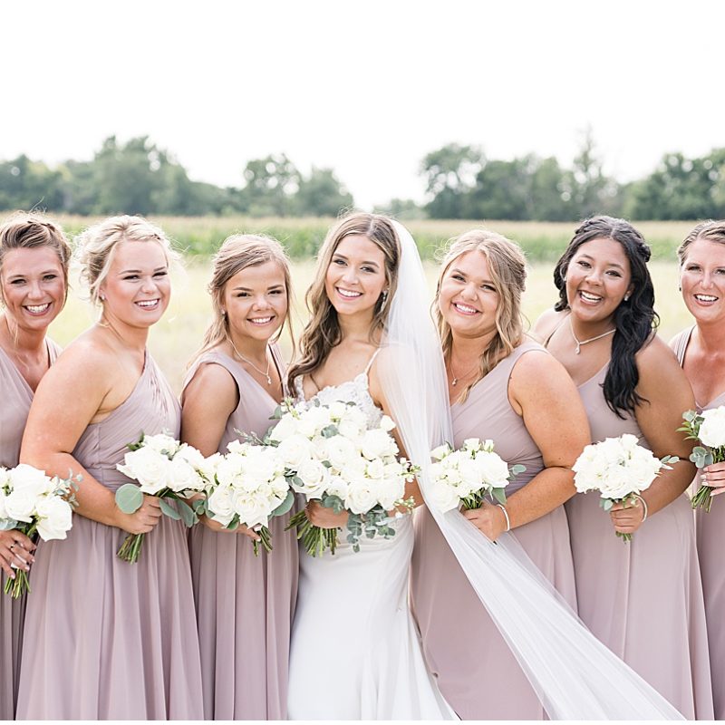 Bride and bridesmaids outside of New Journey Farms