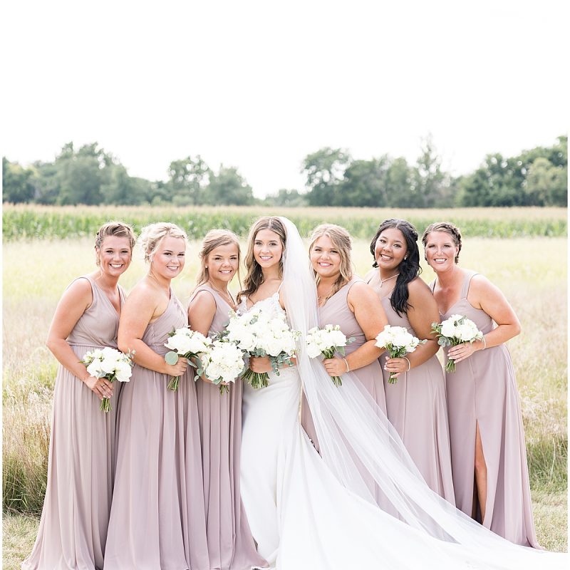 Bride with bridesmaids before wedding ceremony at New Journey Farms