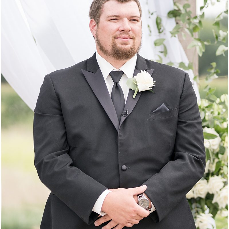 Groom waiting at alter during New Journey Farms Wedding