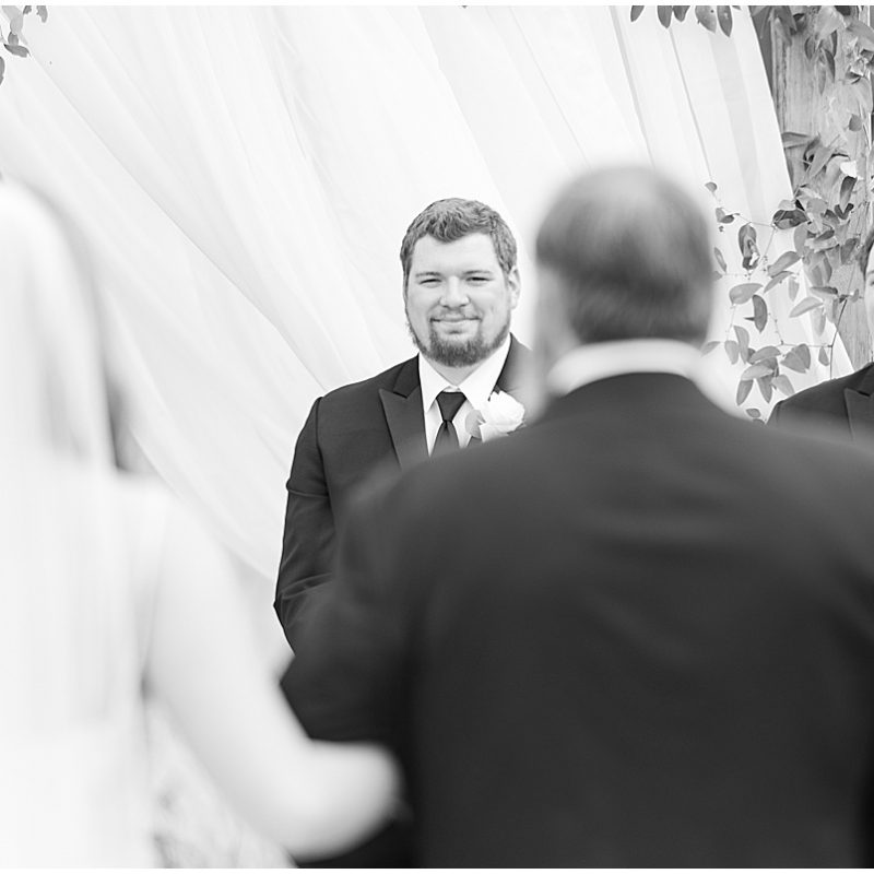 Grooms reaction to bride walking down the aisle at New Journey Farms