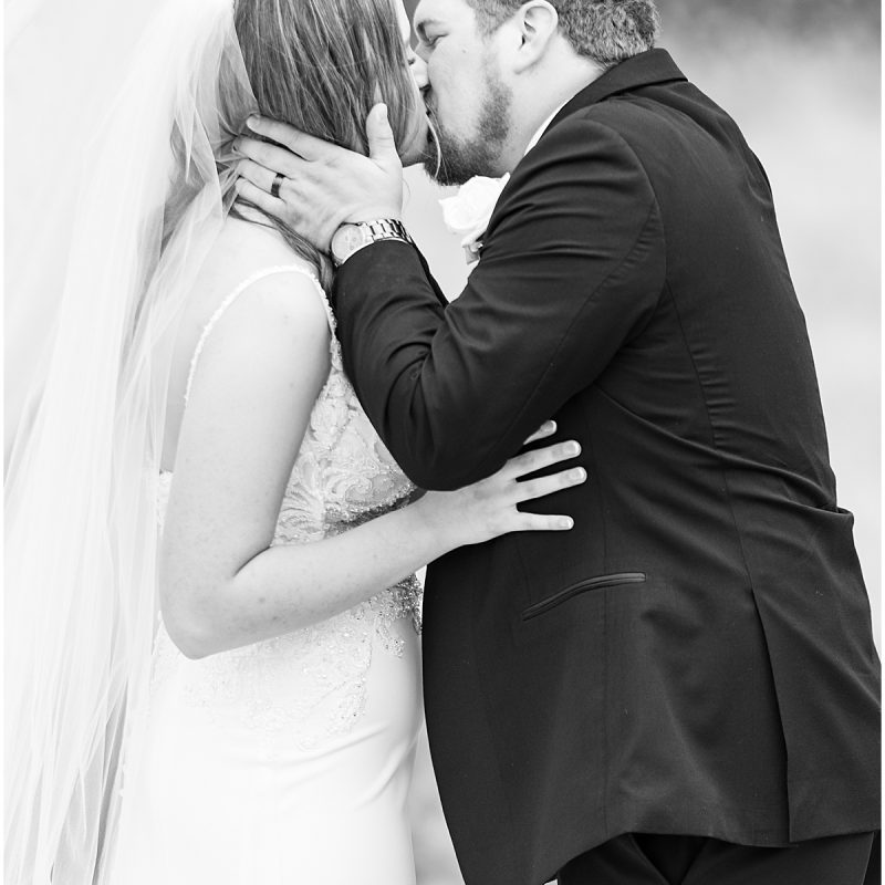 Bride and groom kiss at New Journey Farms Wedding