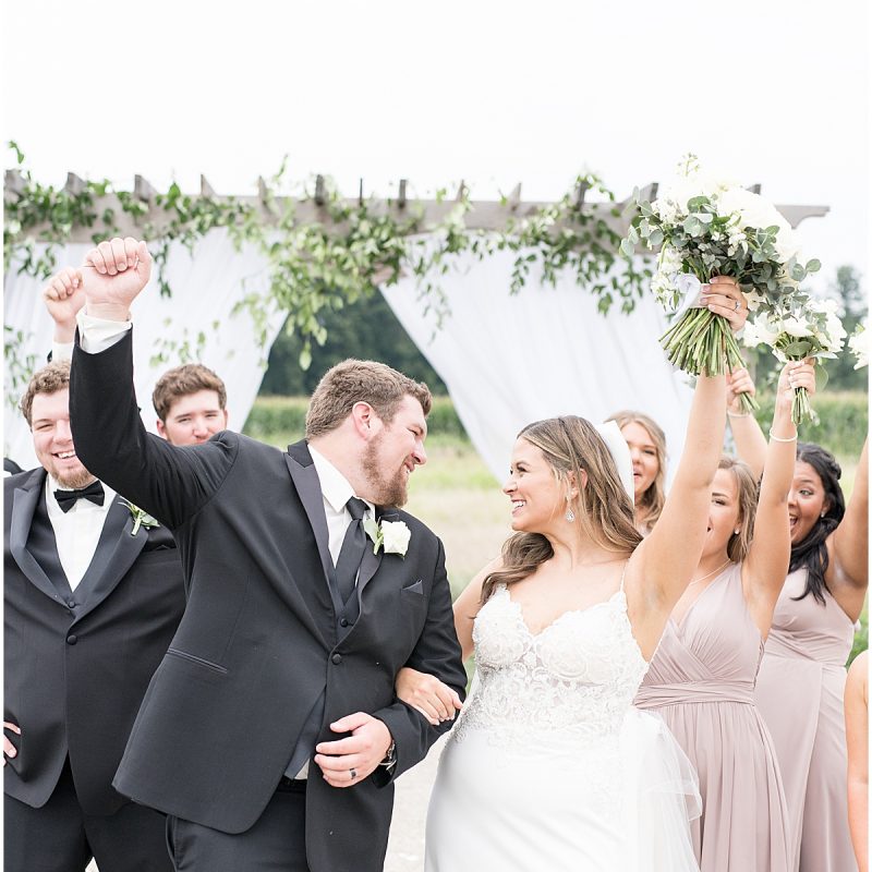 Bride and groom celebrate after wedding at New Journey Farms