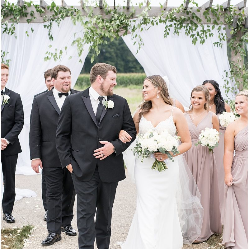 Bride and groom walk back down aisle after New Journey Farms Wedding