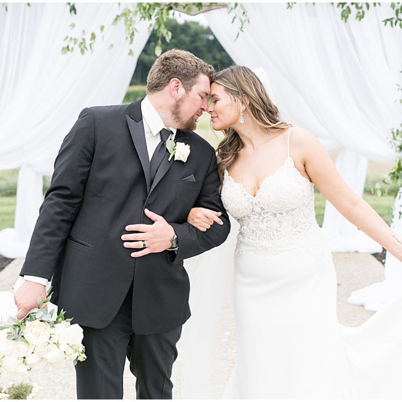 Bride and groom get close after wedding at New Journey Farms