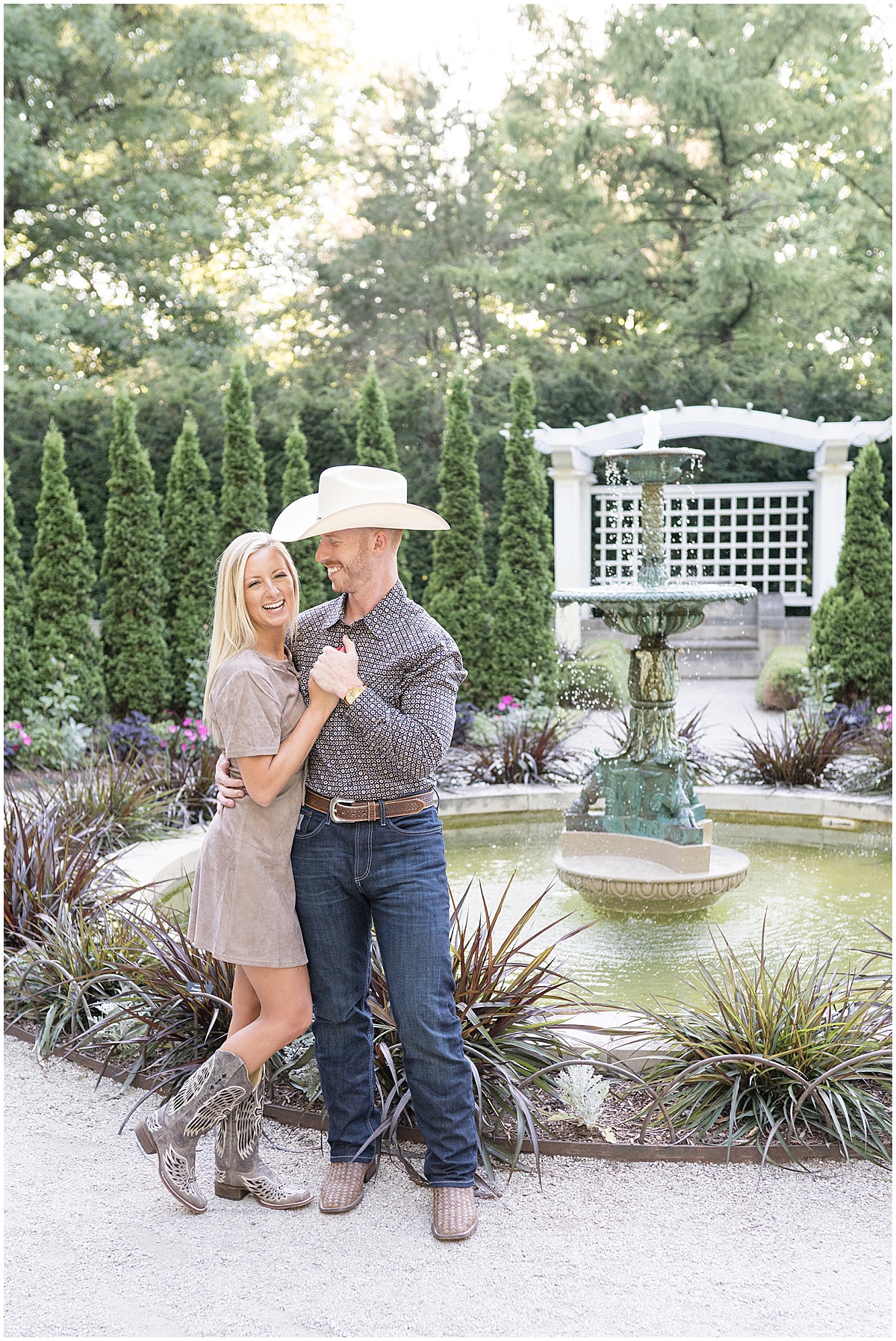 Couple laughing during western-inspired engagement photos at Newfields