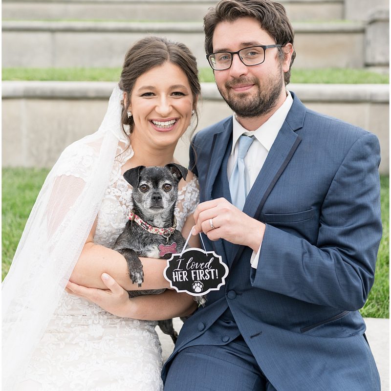 Newlyweds with dog during wedding photos at Coxhall Gardens