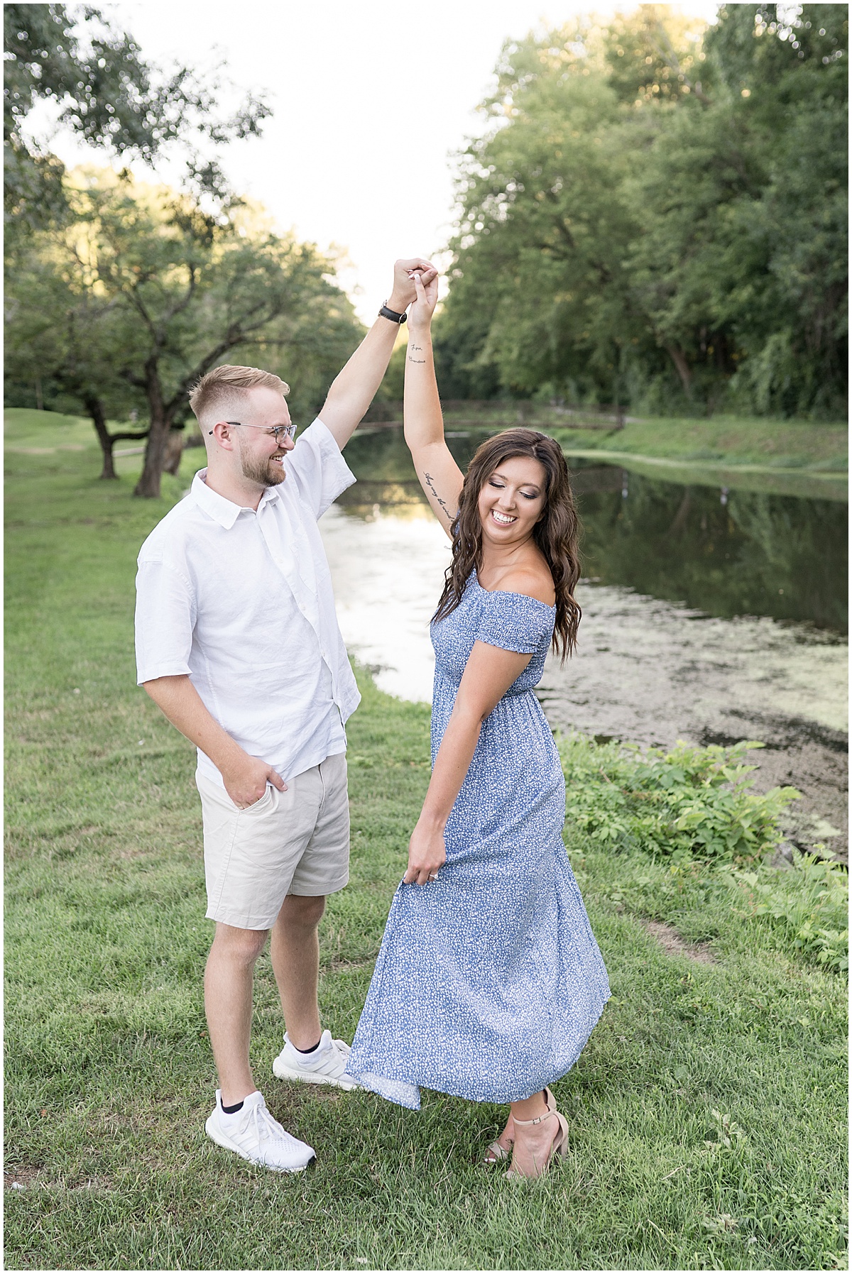 Couple dancing during summer engagement photos at Holcomb Gardens in Indianapolis