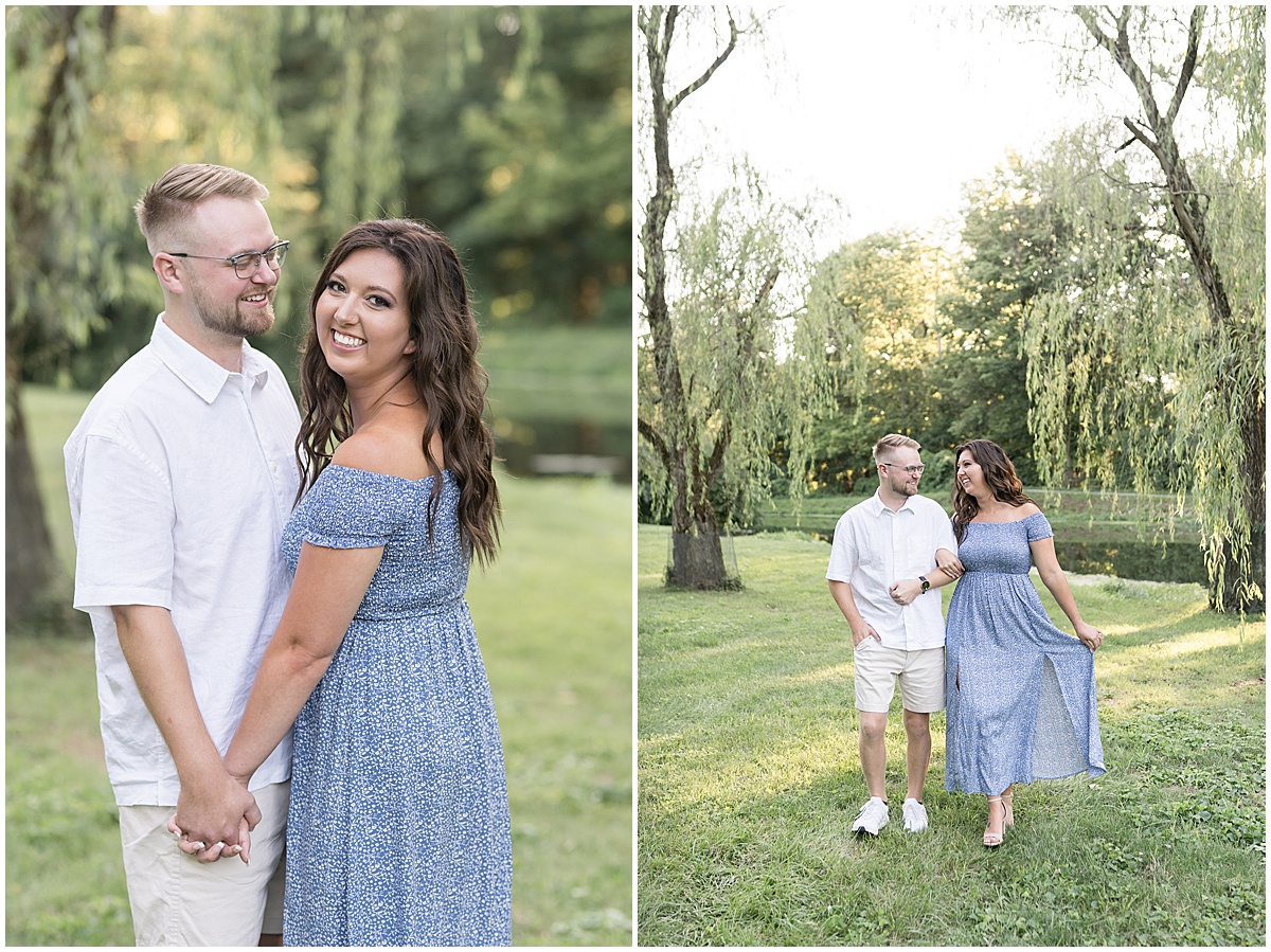 Couple walking during summer engagement photos at Holcomb Gardens in Indianapolis