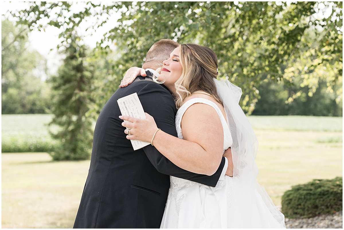 Bride and groom hug at wedding in Converse, Indiana