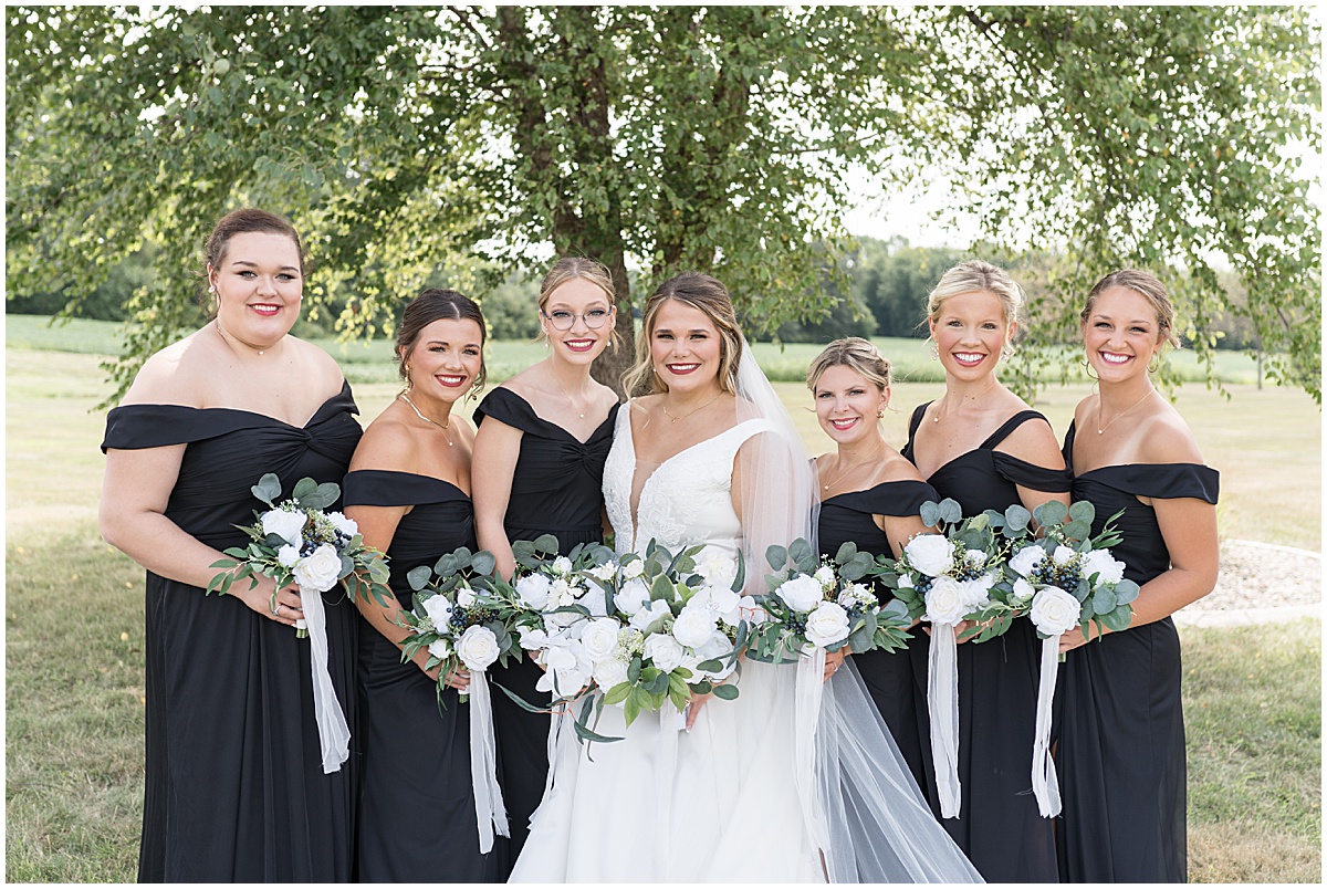 Bridesmaids in black dresses at wedding in Converse, Indiana