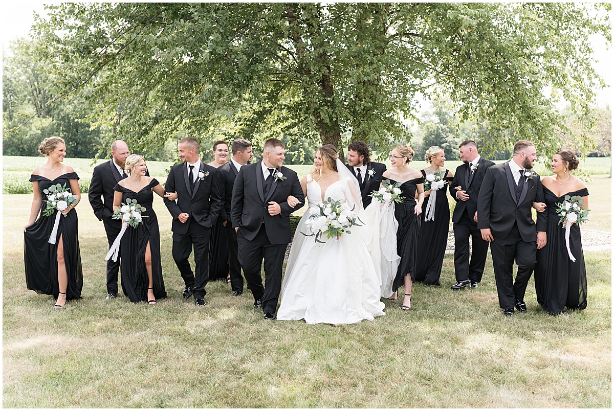 Bridal party walking together at wedding in Converse, Indiana