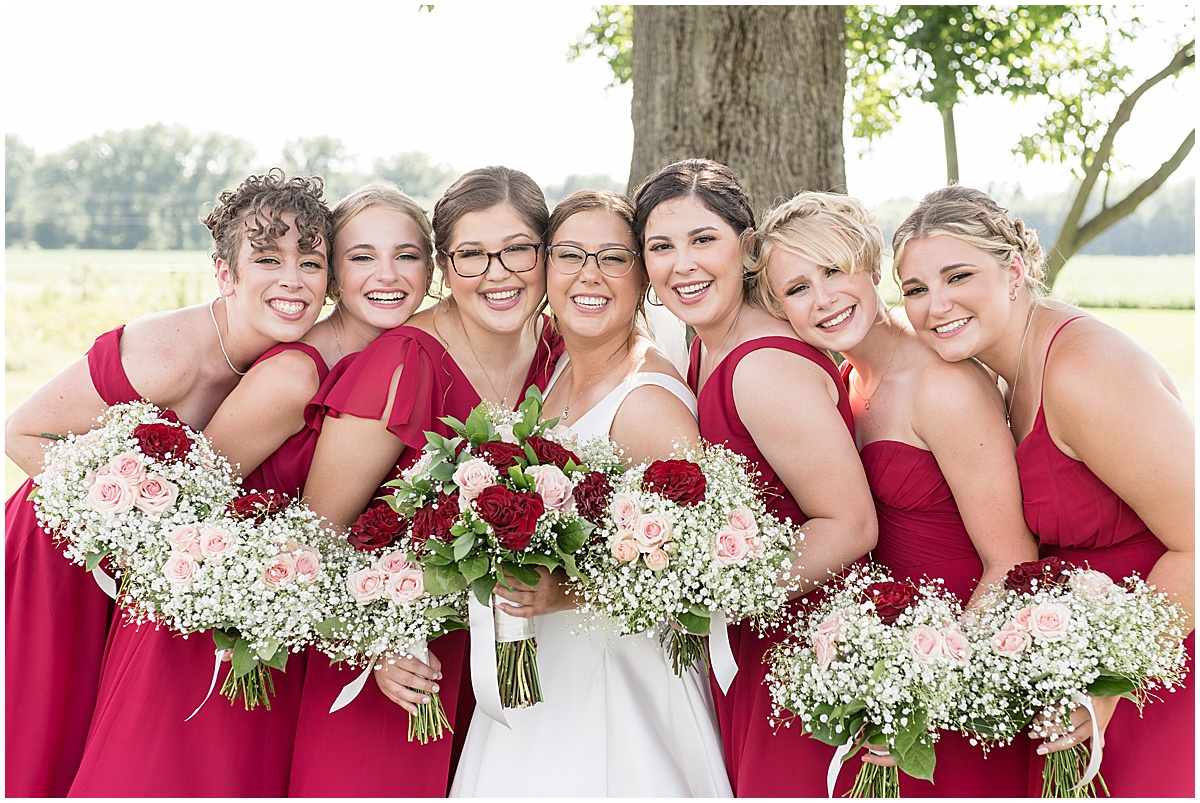 Bridesmaids huddle together at Churchill Farms wedding in Lake Village, Indiana