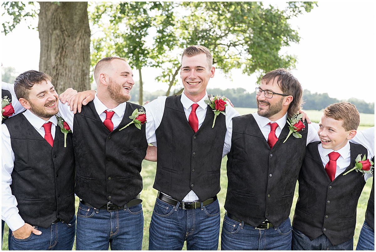 Groomsmen laugh together before Churchill Farms wedding in Lake Village, Indiana
