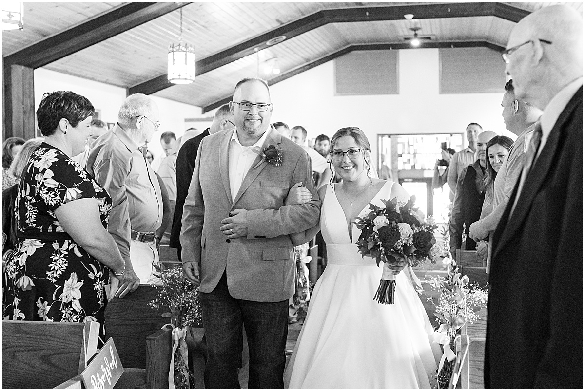 Bride walking down the aisle at wedding ceremony at St. Augusta Catholic Church in Lake Village, Indiana